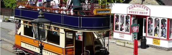 Crich Tramway village open top tram and sweet shop