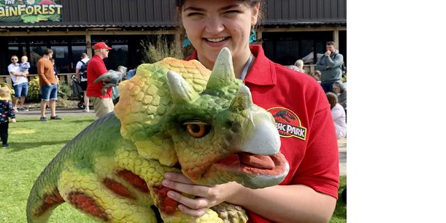 MFP Lady holding a dinosaur